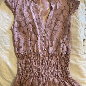 Lilac shirt, bunches at waist, small cap sleeve.